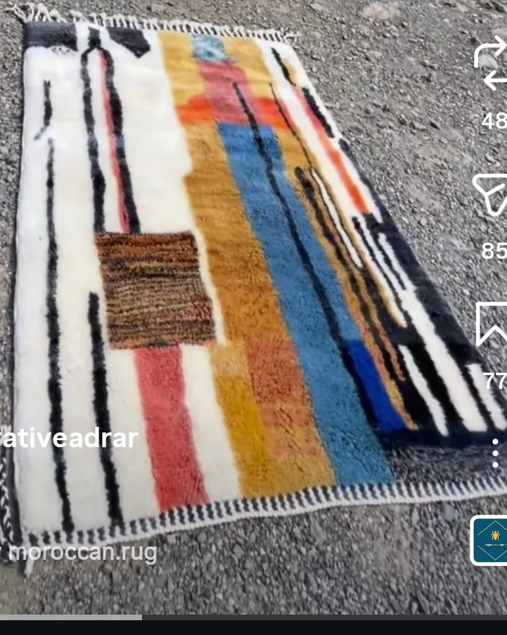 Handwoven Moroccan rug displayed outdoors in the Atlas region