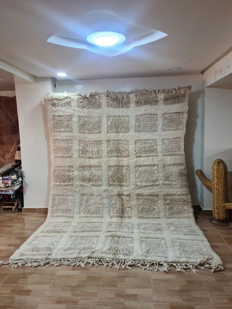 Ivory Moroccan rug with abstract blue-grey fragmented block and mosaic pattern across the field