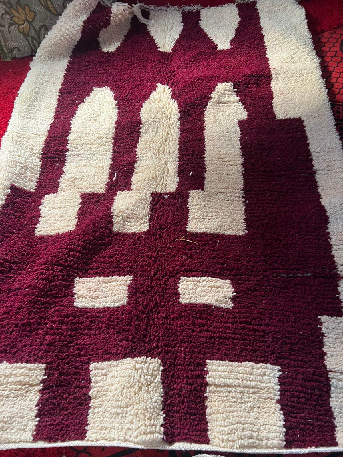 Beni Ourain rug in deep burgundy and ivory with bold arch and column motifs