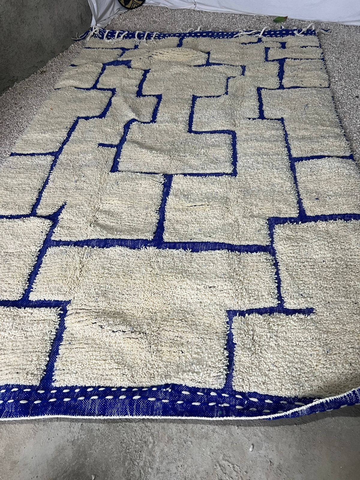 High-pile Mrirt rug in ivory with bold cobalt blue abstract geometric lines