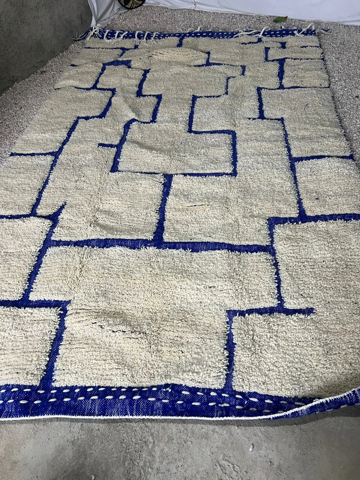 High-pile Beni Ourain rug in ivory with bold cobalt blue abstract geometric lines