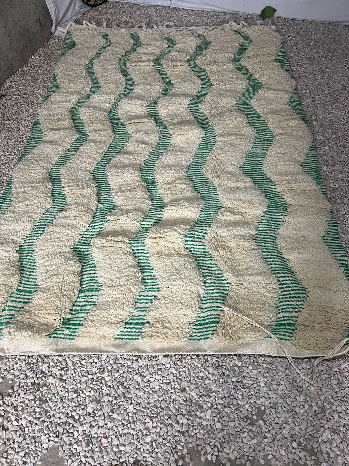 High-pile Mrirt rug in ivory and sage green with flowing horizontal wave stripe pattern