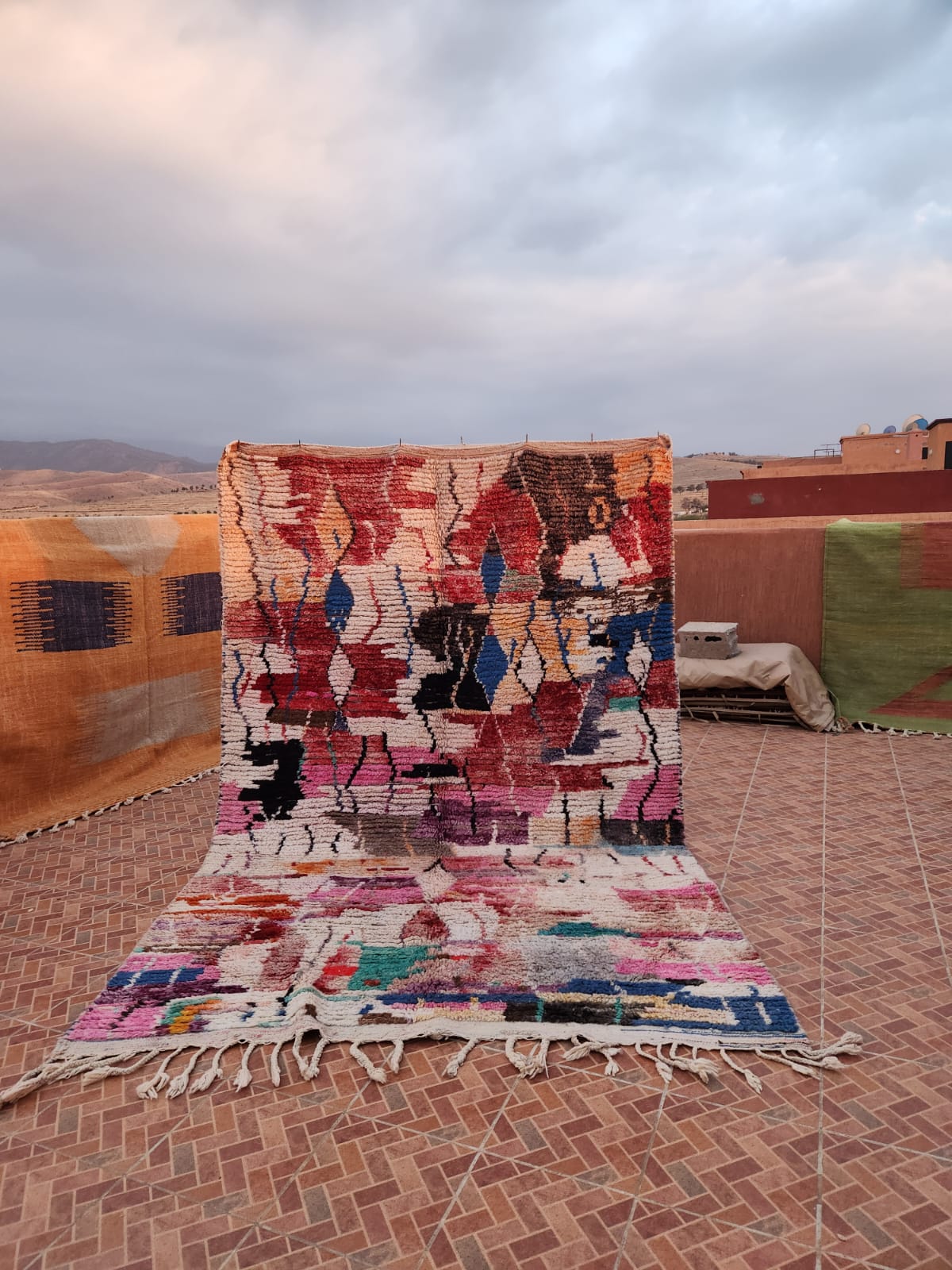 Vintage Boujaad rug with deep red and ochre field and dense Amazigh motifs