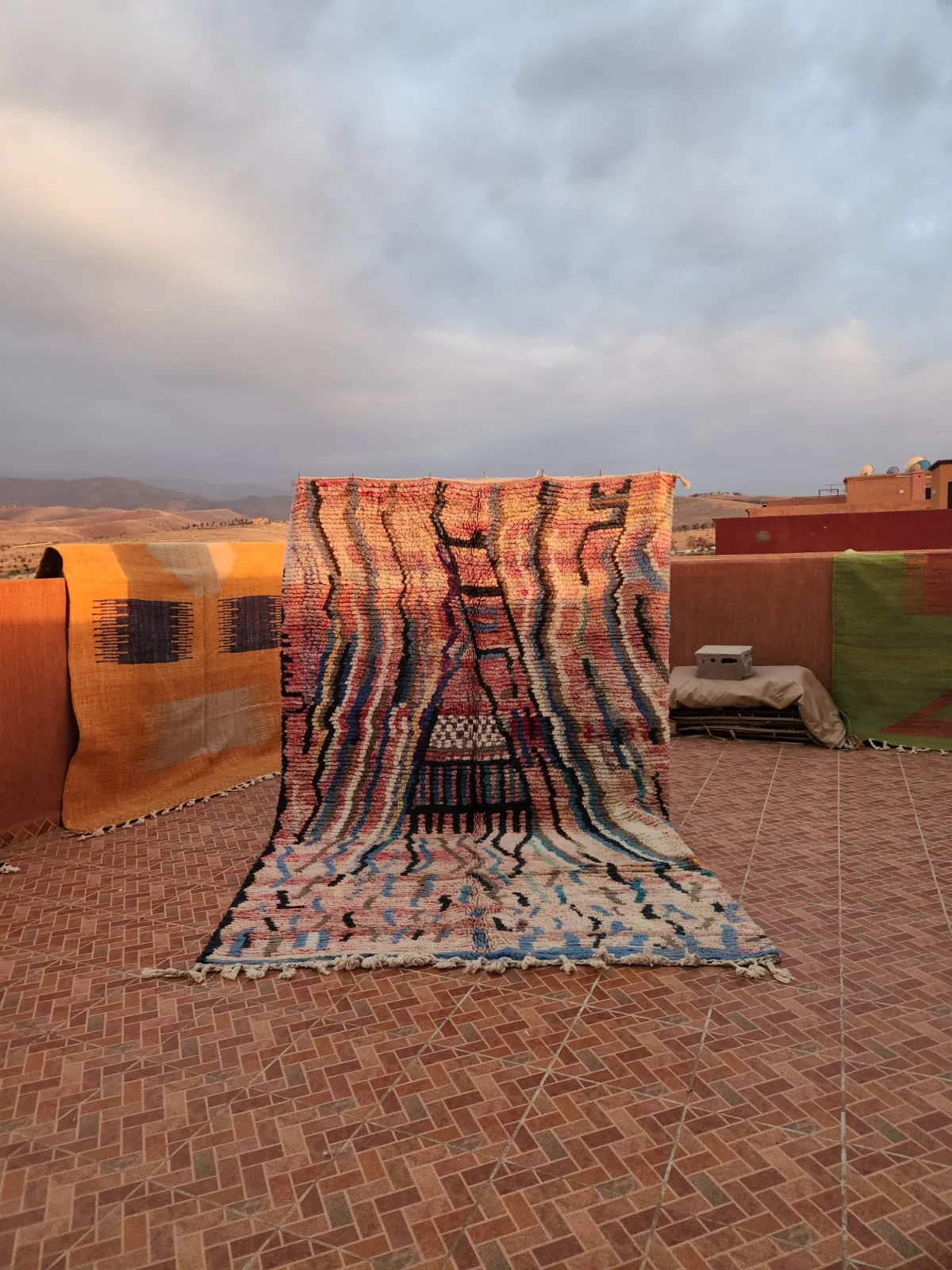 Wave-stripe Boujaad rug in undulating bands of warm color