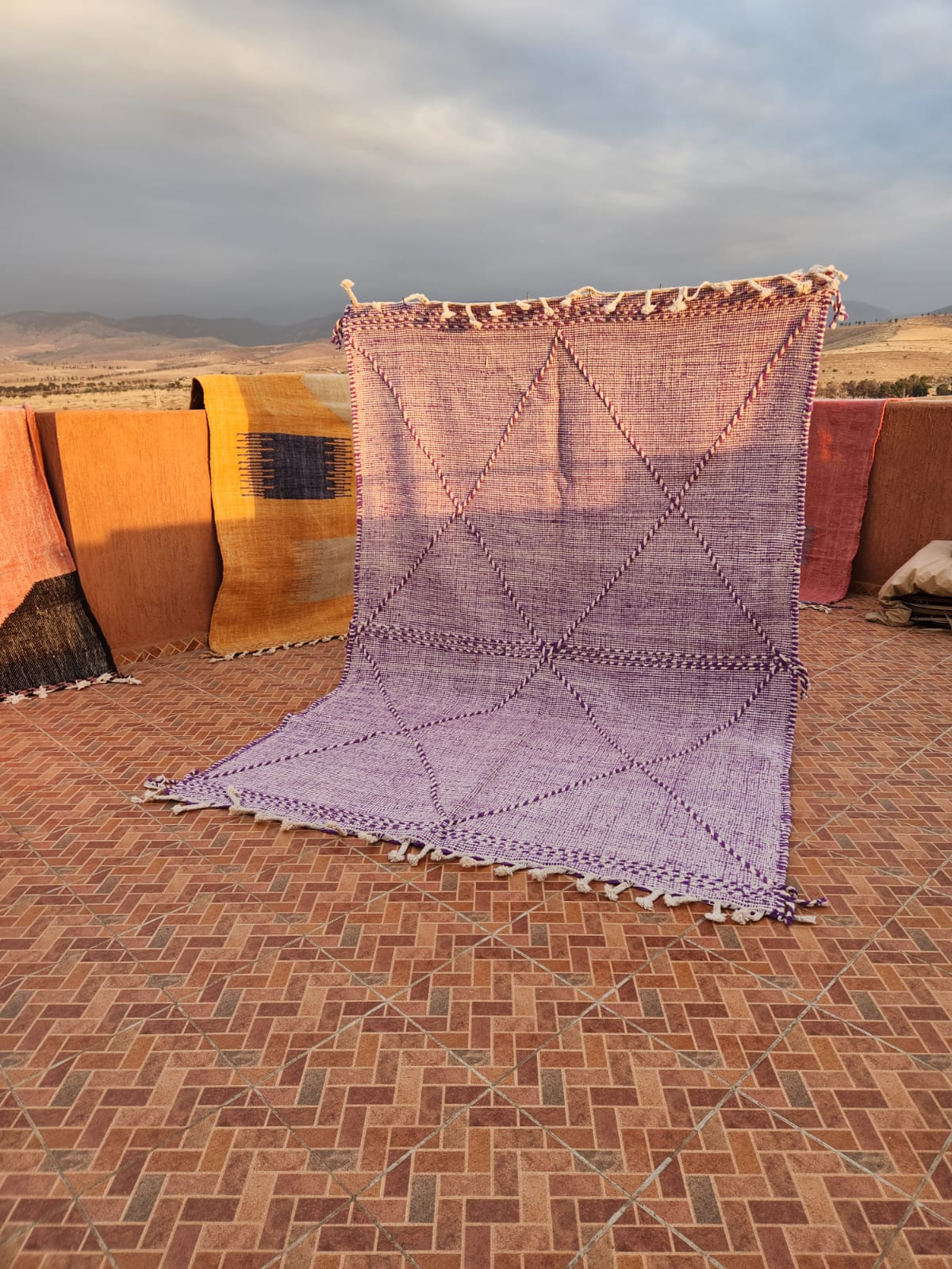 Dusty violet flat-woven Kilim with precise diamond grid lattice shifting from deep purple to pale mauve