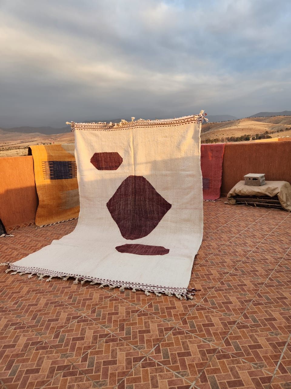 Ivory flat-woven Kilim with two large dark maroon abstract geometric shapes