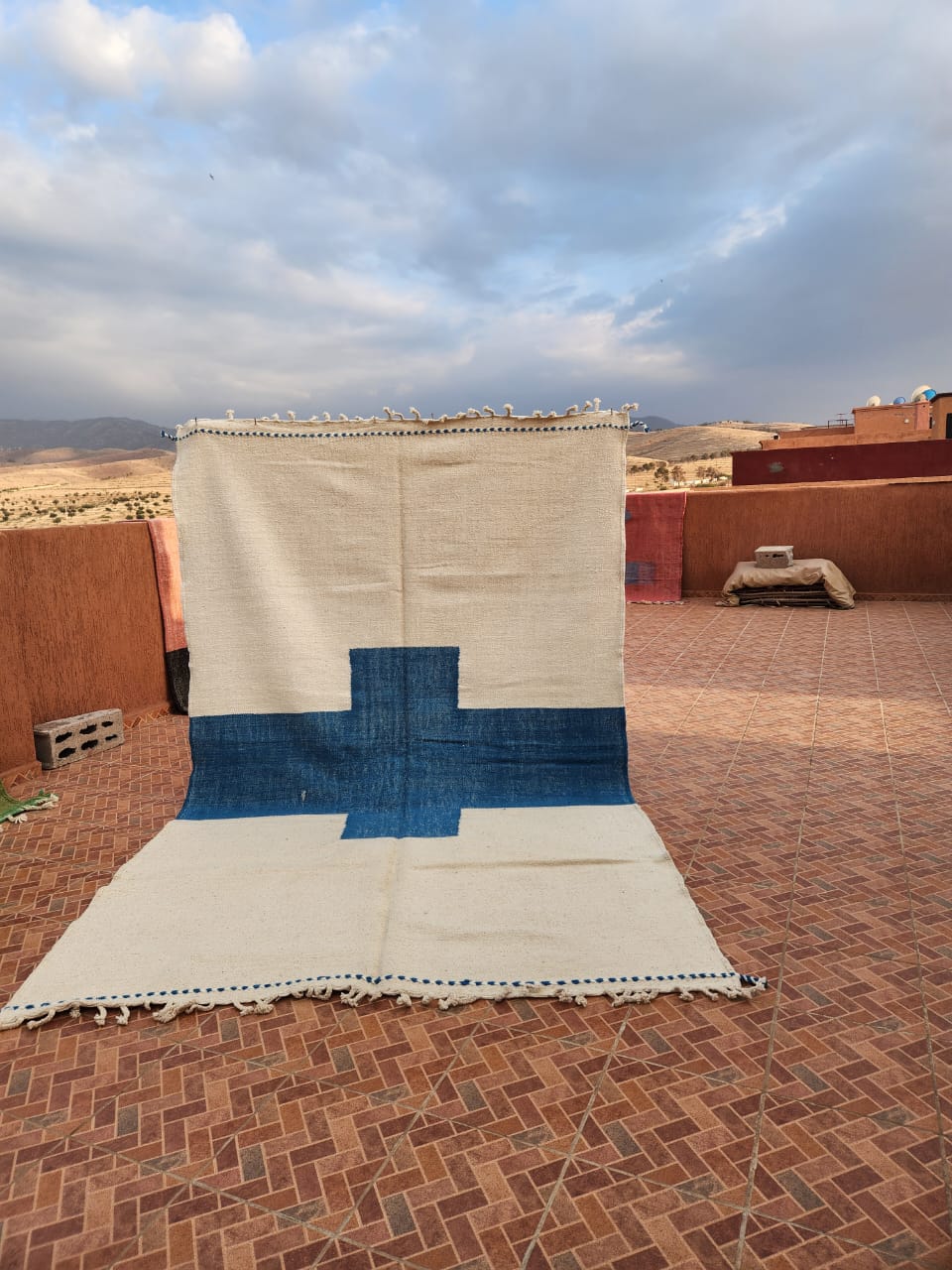White flat-woven Kilim with large indigo blue cross motif at centre