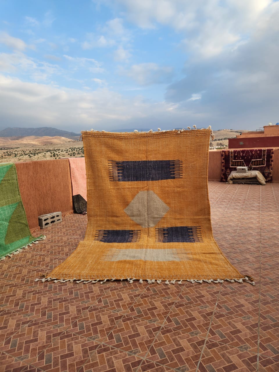 Vintage flat-woven Kilim in warm golden amber and deep navy with geometric pattern