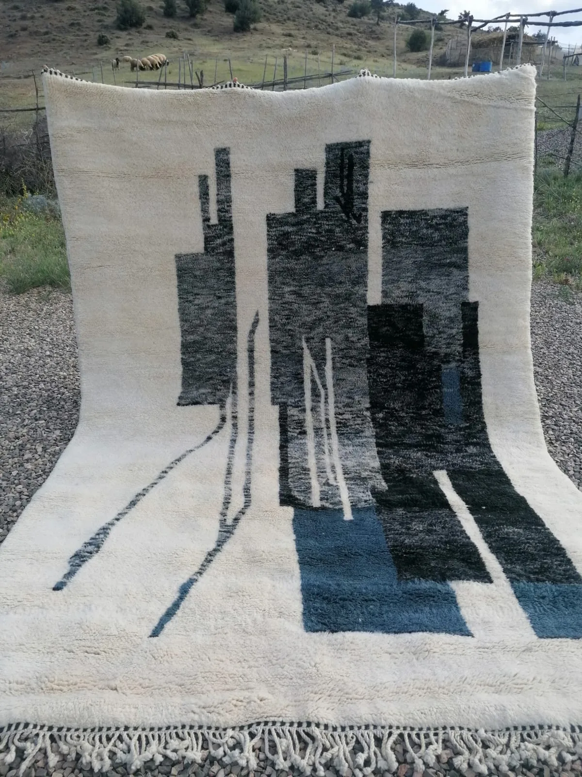 Ivory Moroccan rug with abstract charcoal and teal architectural block columns