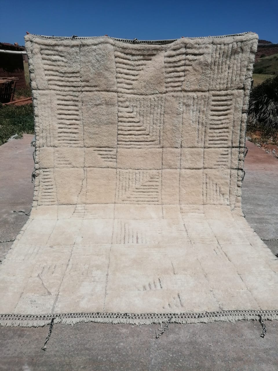 Natural ivory Moroccan rug with deeply carved tonal geometric grid and square repeat pattern