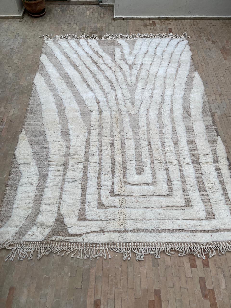 Large ivory Moroccan rug with flowing organic nested arch lines creating a Y-shaped tree silhouette