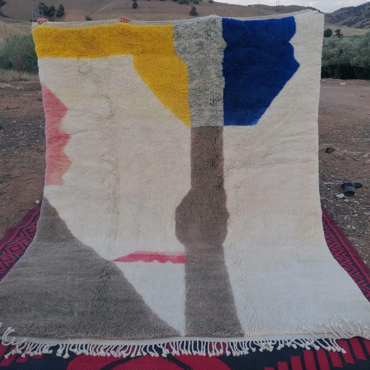 Ivory Moroccan rug with large bold abstract colour blocks in mustard yellow, cobalt blue, blush pink and warm grey