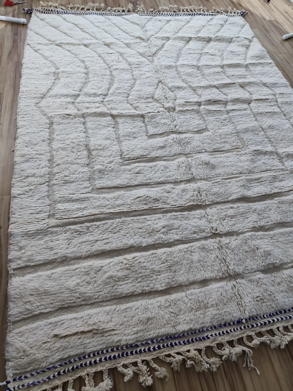 Ivory Mrirt rug with a hand-carved nested concentric medallion