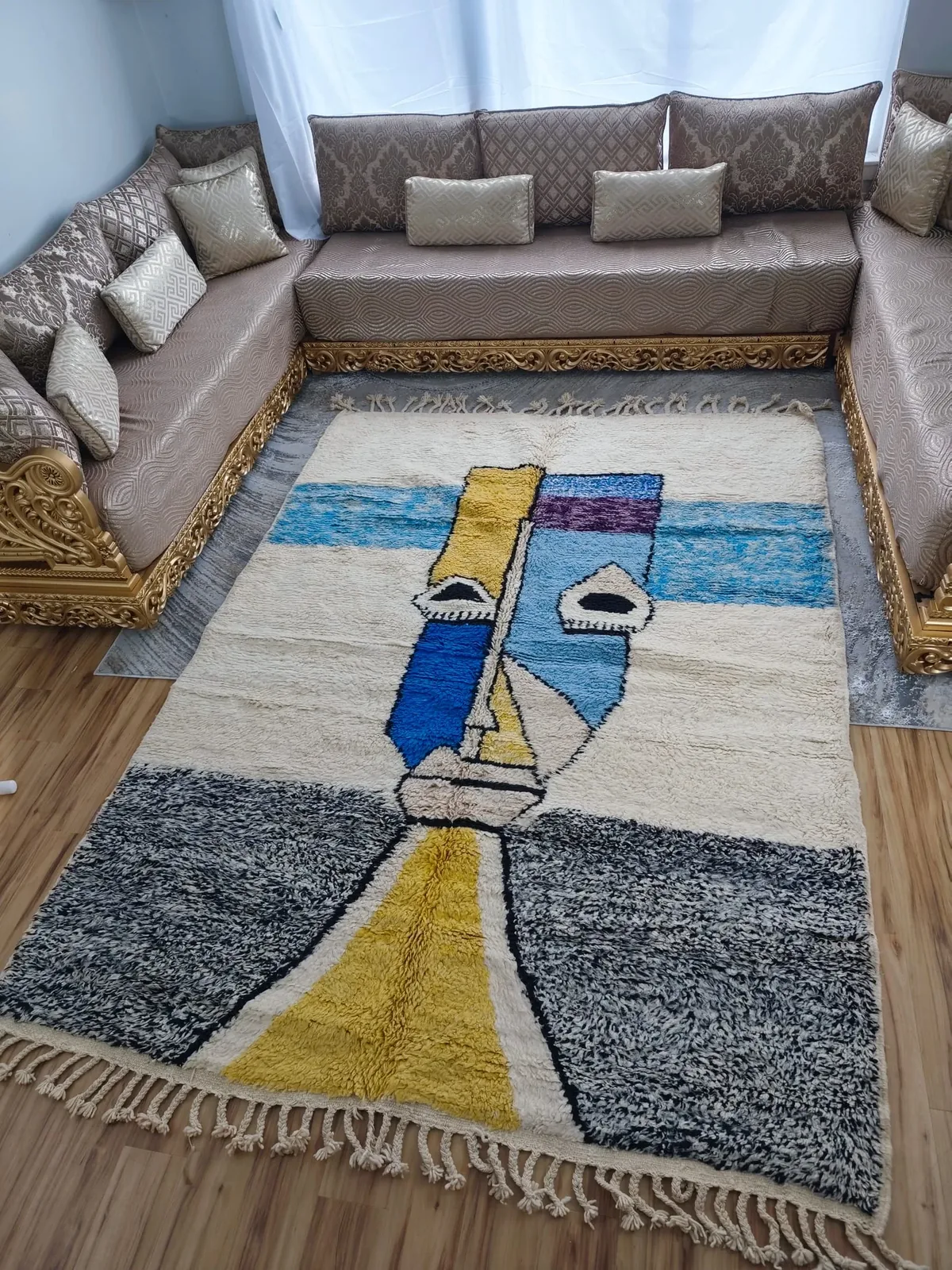 Picasso-inspired abstract art Moroccan rug with cubist face in blue, yellow and grey