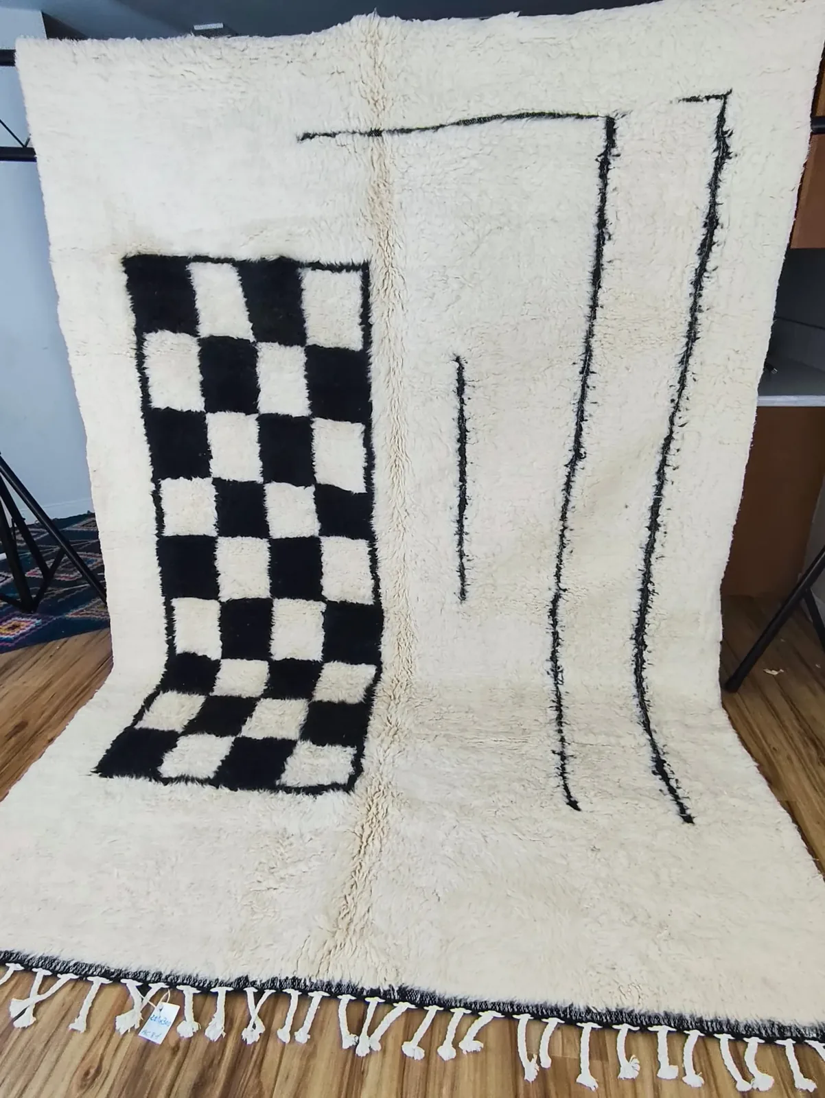 Black and white graphic contemporary Moroccan rug with checkerboard and line art