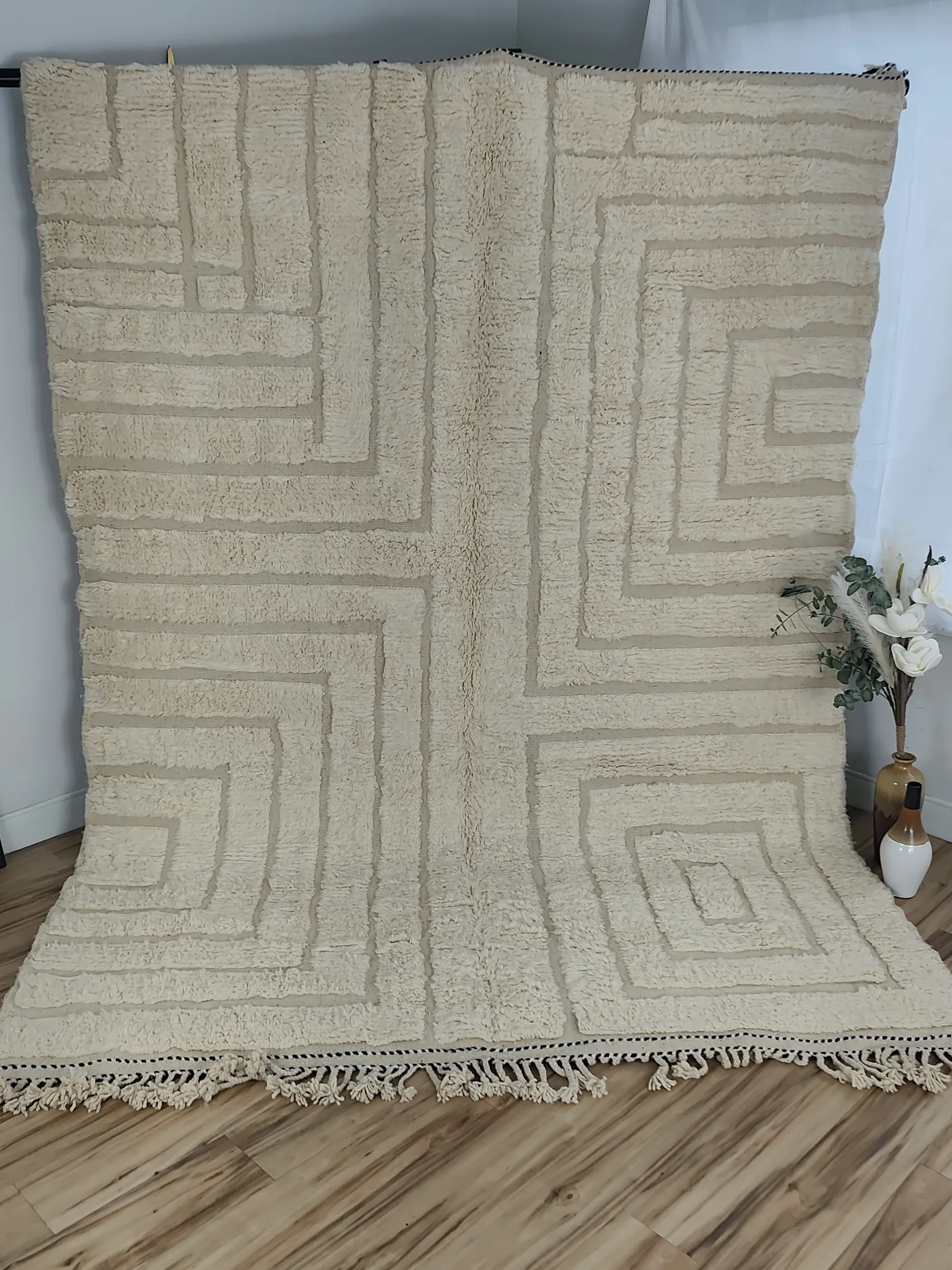 Latifa — hung from a rail, the maze seen square on, all ivory, no color — the pattern comes entirely from depth, 271 × 200 cm, view 16 of 21