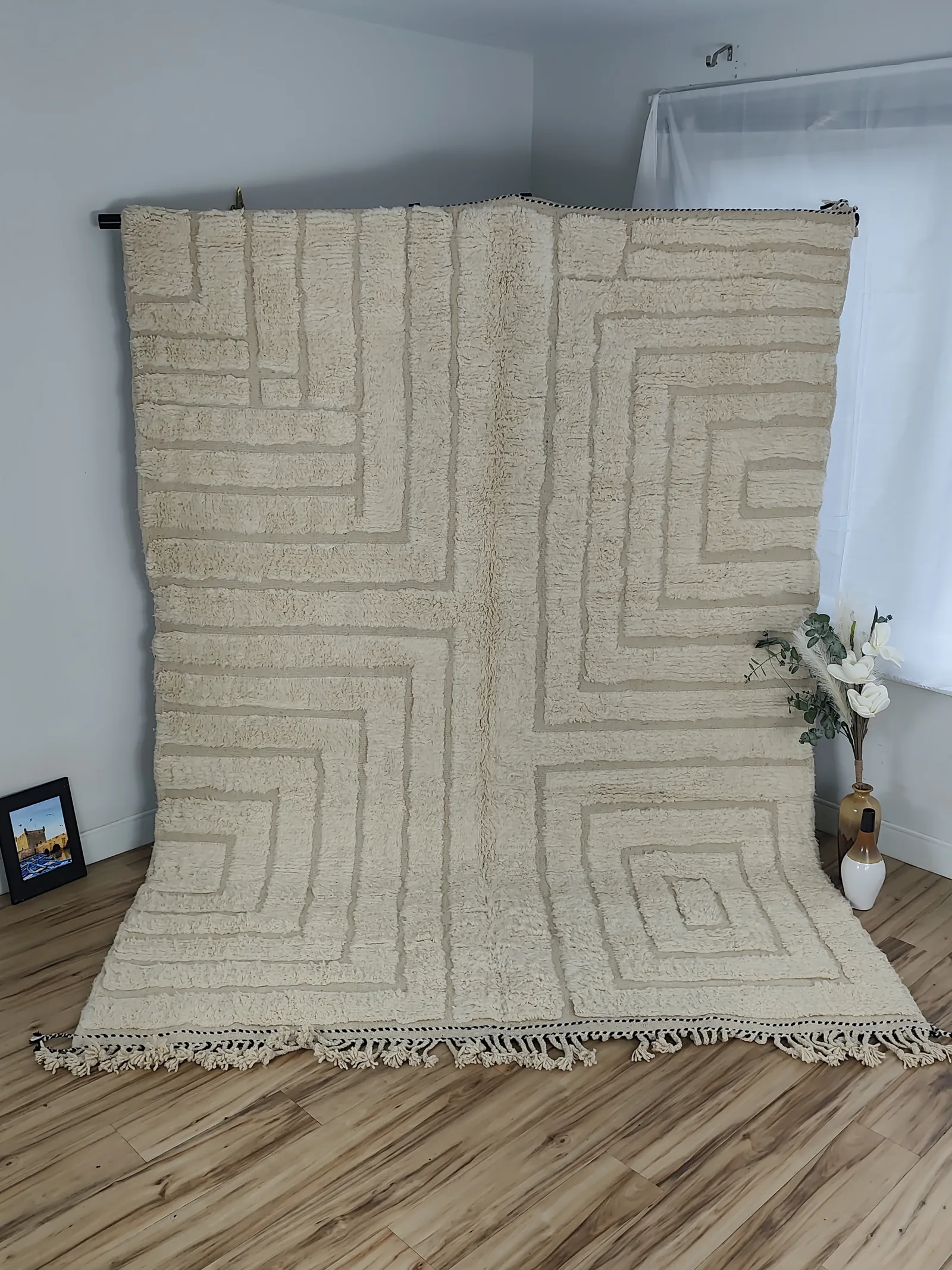 Latifa — hung from a rail in the corner of the room, a rug that reveals itself slowly, view 9 of 21