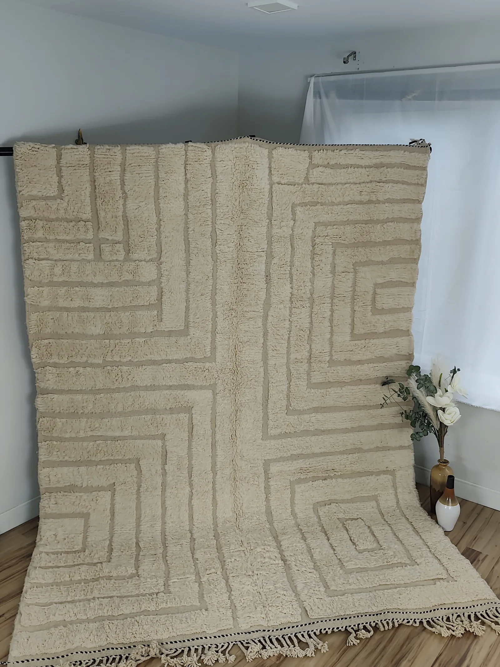 Latifa — hung from a rail, the maze corridors running to the floor, hand-knotted wool, medium pile, sculptured/carved, view 3 of 21