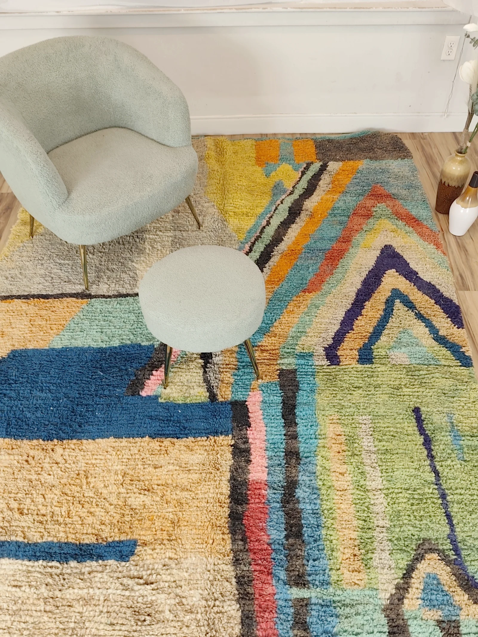 Soukaina — a chair and stool on the rug, close in on the chevrons, teal, blush and mustard Boujaad rug, high pile, view 8 of 20