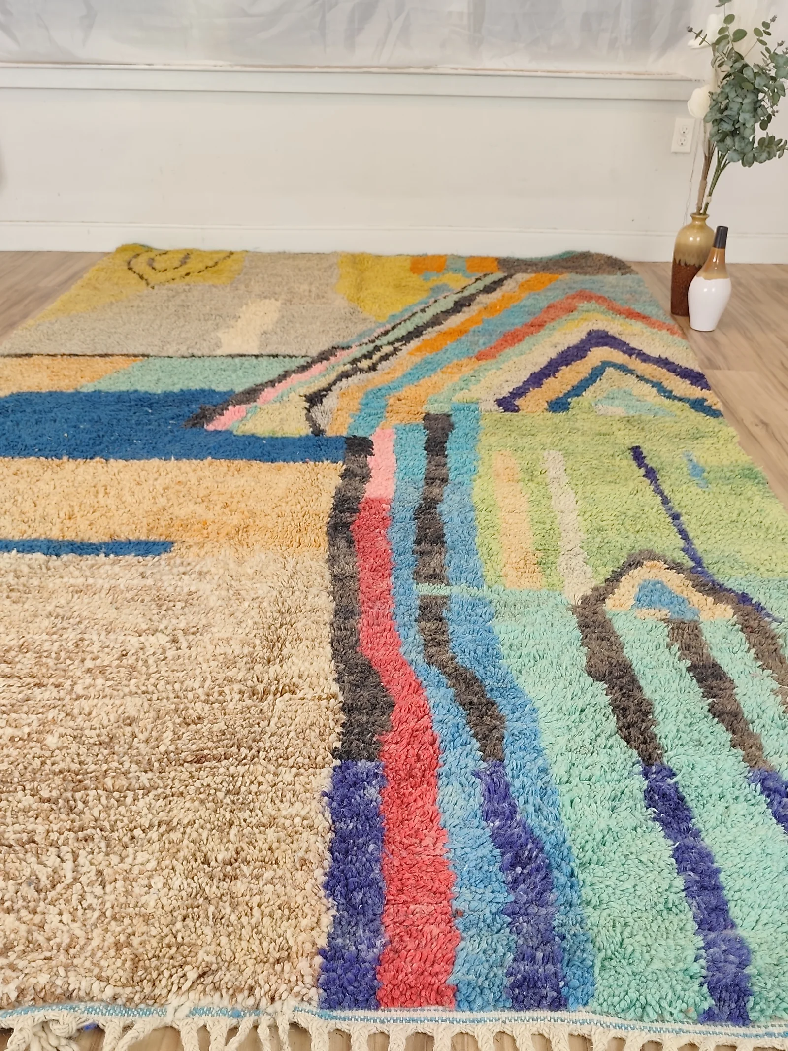 Soukaina — a close view of the sandy field and coloured stripes, an abstract Boujaad in teal, blush and mustard, with bold diagonal bands cutting across a cream ground, view 18 of 20