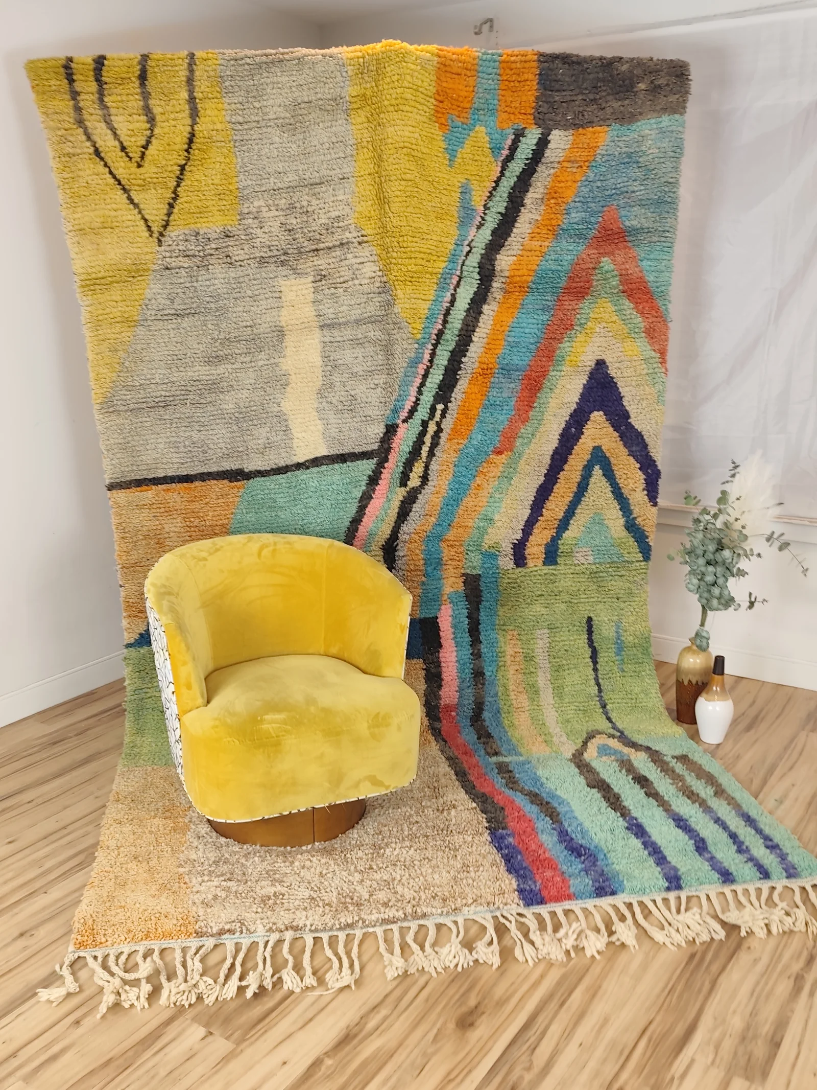 Soukaina — an ochre velvet chair in front of the hung rug, 323 × 178 cm Boujaad Moroccan rug in teal, blush and mustard, view 19 of 20