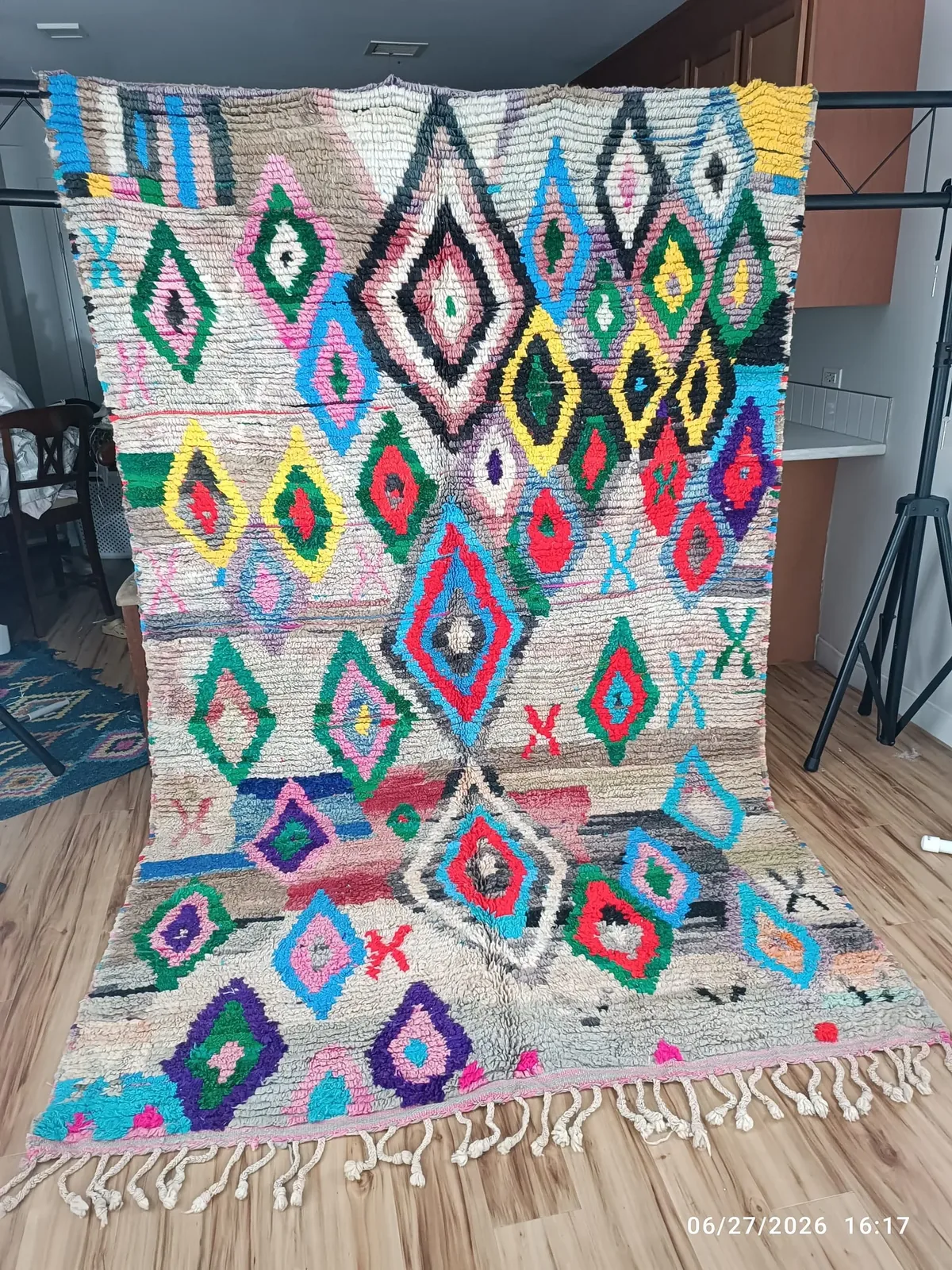 Vivid tribal Boujaad rug with diamond and eye motifs in red, pink, orange, teal and green