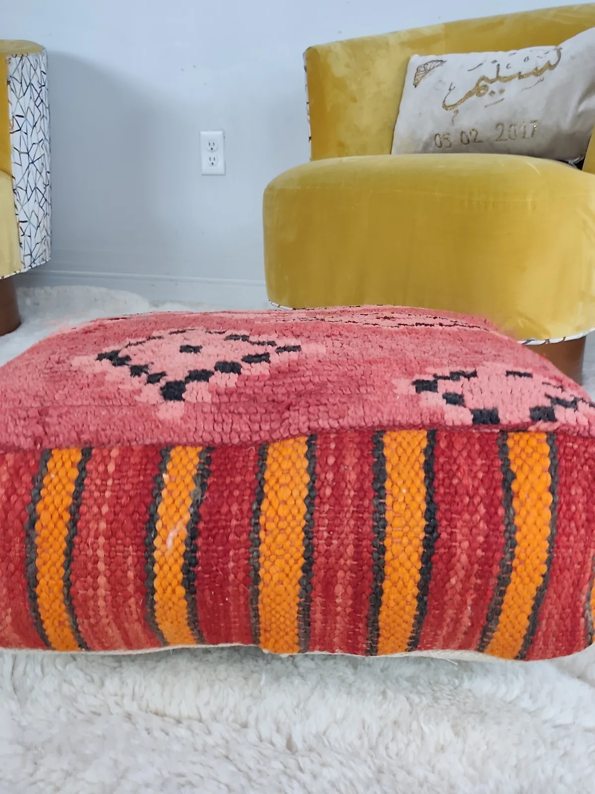 Damya — coral stripe pouf, angled view showing the depth of the pile, view 2 of 7