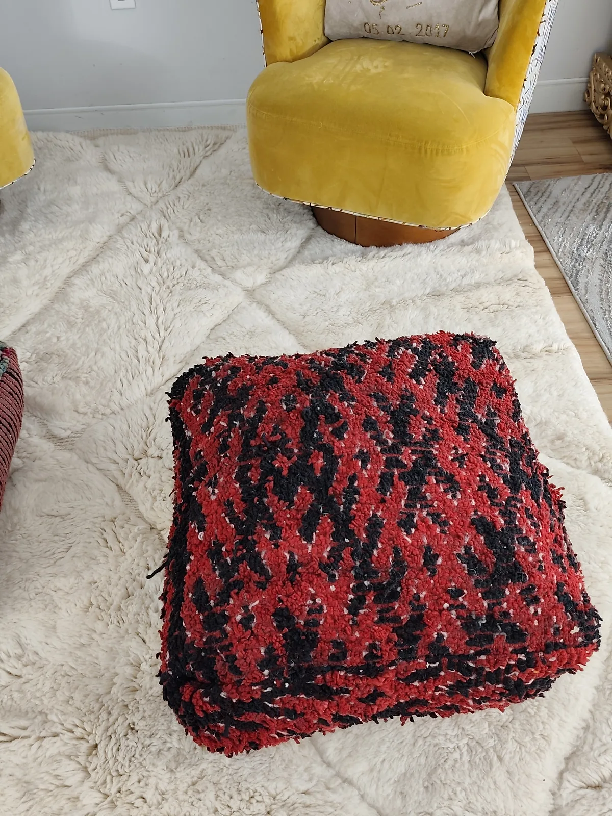 Kahina — red & black boucherouite pouf, in a room setting for scale, view 7 of 7