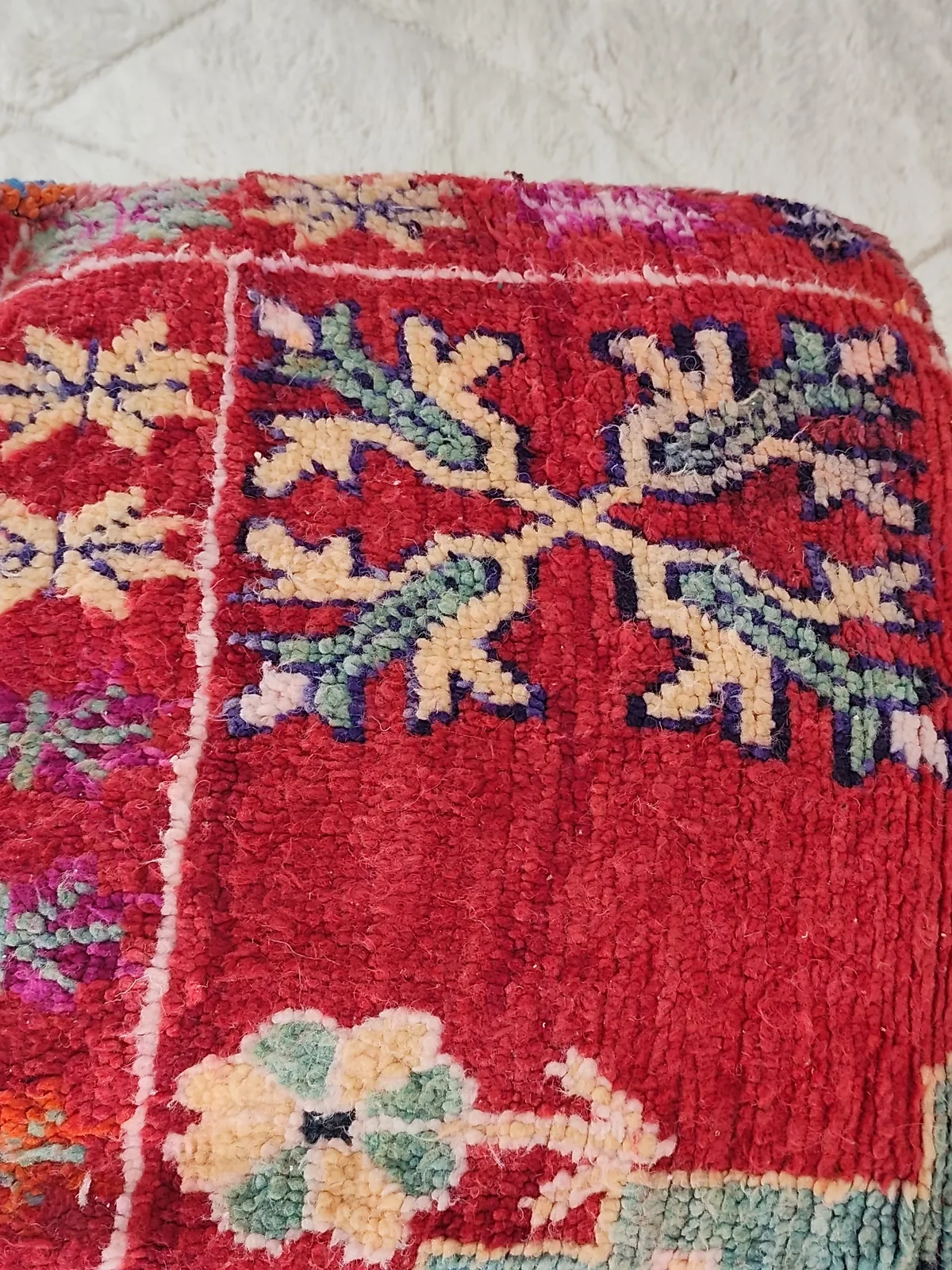 Tinhinan — botanical crimson pouf, angled view showing the depth of the pile, view 2 of 8
