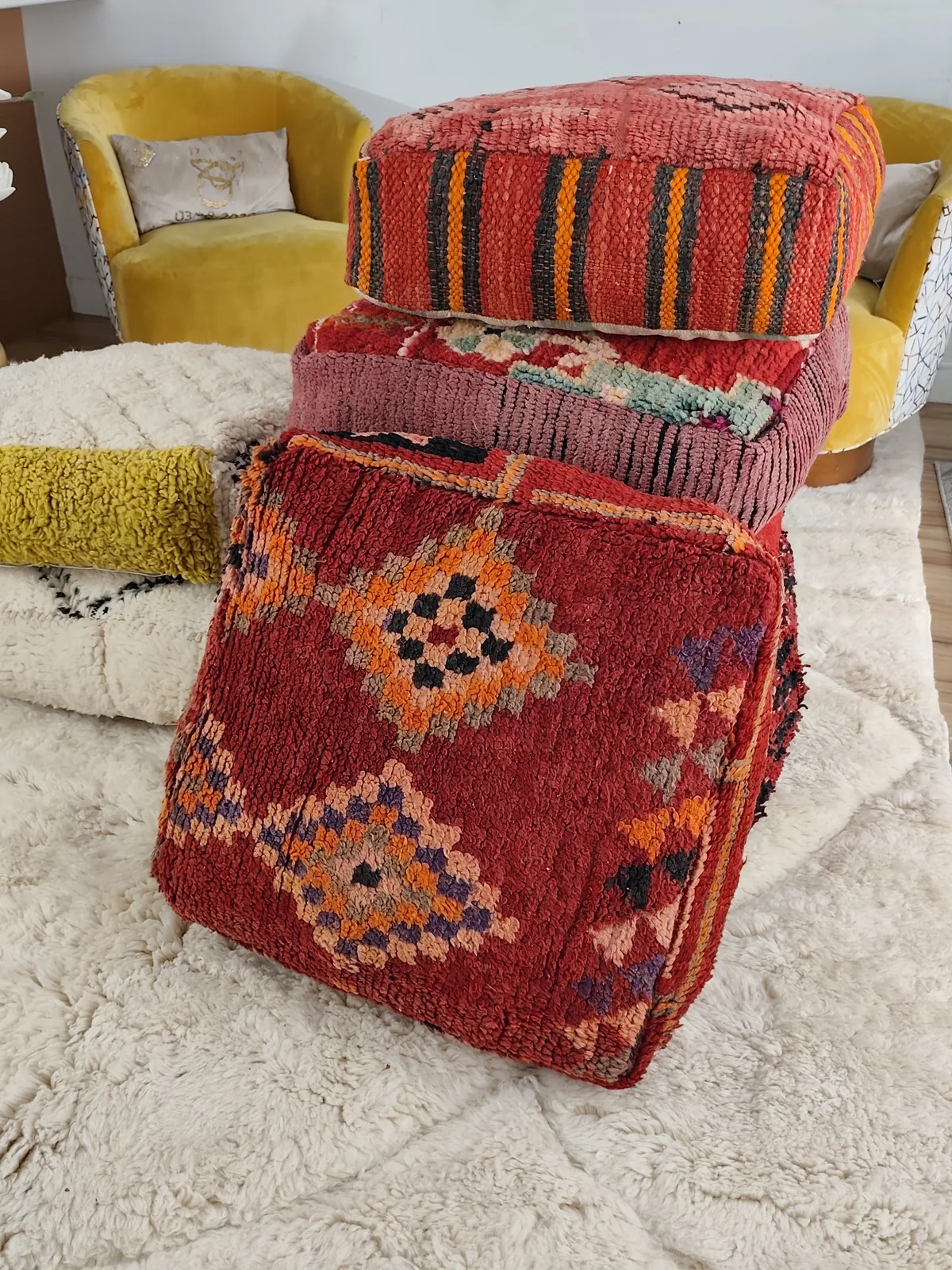 Zohra — amber diamond pouf, styled beside a mustard armchair, view 6 of 6